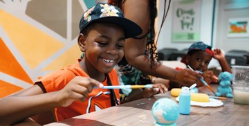 Enjoying a creative Pottery Creations session