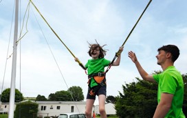 Kids can reach for the stars when they bounce about on the bungee trampoline.