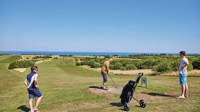 Golfers on one of the holes at the golf course at Reighton Sands