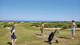 Golfers on one of the holes at the golf course at Reighton Sands