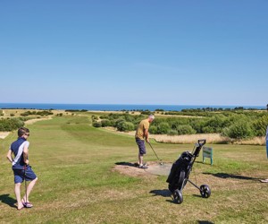 Golfers on one of the holes at the golf course at Reighton Sands