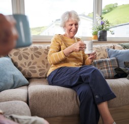 An owner enjoys a cup of tea from the comfort of her pre-loved holiday home.