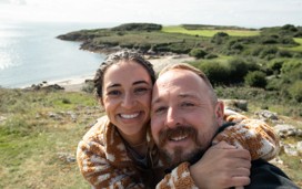Couple taking a selfie at the sea near Hafan y Mor