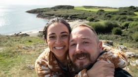 Couple taking a selfie at the sea near Hafan y Mor