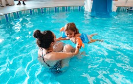 Mother and child in a swimming pool