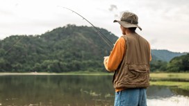 A man fishing in a lake 