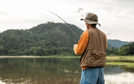 A man fishing in a lake 