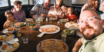 Family dining in Coast House, Hafan y Mor