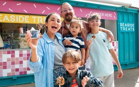 Toddler enjoying an ice cream from Haven's Seaside Treats venue