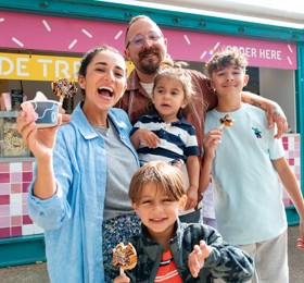Toddler enjoying an ice cream from Haven's Seaside Treats venue