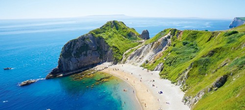 5. Visit the peacefulness at Lulworth Cove