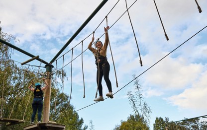 A teenage girl tackles aerial obstacles at Primrose Valley, Yorkshire.