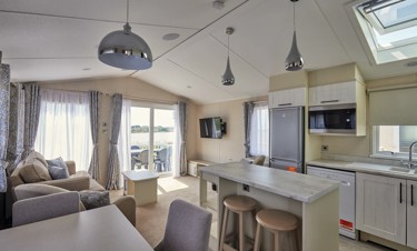 Representation of a kitchen, lounge and dining area in a Luxury Lodge